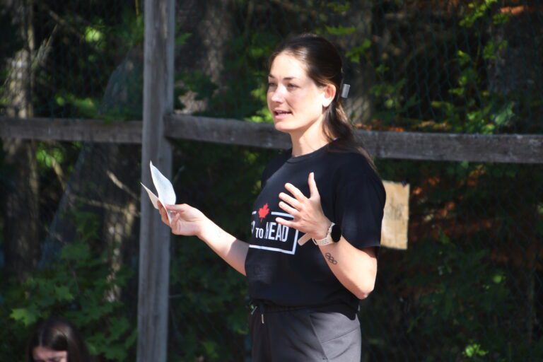 A person in a black t-shirt makes a presentation
