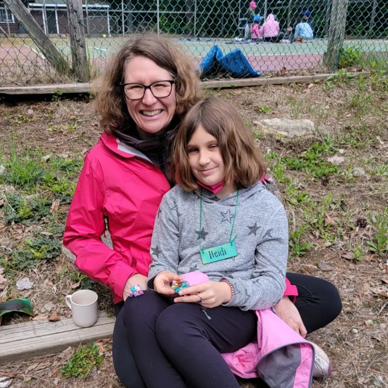 A woman with a child on her lap
