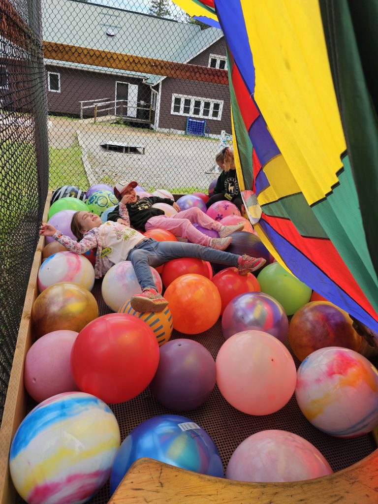 Children play in a ball pit